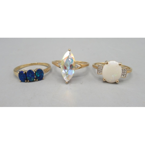 483 - 10ct yellow gold ring set with large marquise cut clear stone, size U, and two more 10ct yellow gold... 