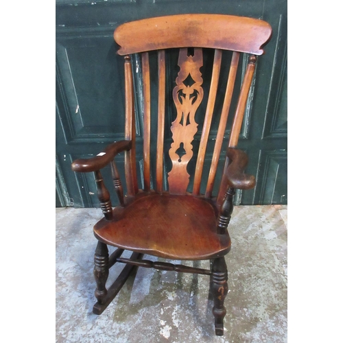 562 - Victorian ash and elm high slat back rocking chair, on turned supports