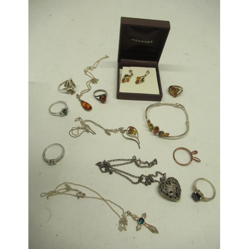 380 - Collection of silver jewellery, mostly set with amber, including a matching bracelet, ring, drop ear... 