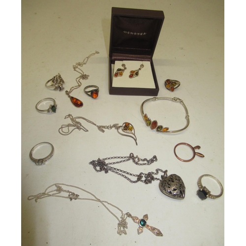 380 - Collection of silver jewellery, mostly set with amber, including a matching bracelet, ring, drop ear... 