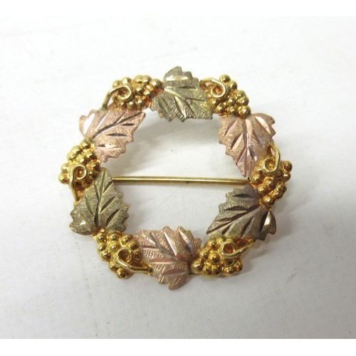 52 - 10ct multi tone gold wreath brooch, stamped 10k, 3.8g, two silver fobs, and a collection of costume ... 