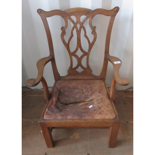 569 - Geo. 111 style oak child's chair, pierced splat, drop in seat and scroll arms on square supports wit... 