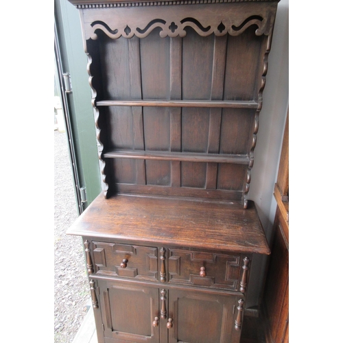 571 - Oak cottage dresser, twin shelf back above two moulded drawers and two doors, on bracket feet. W90cm... 