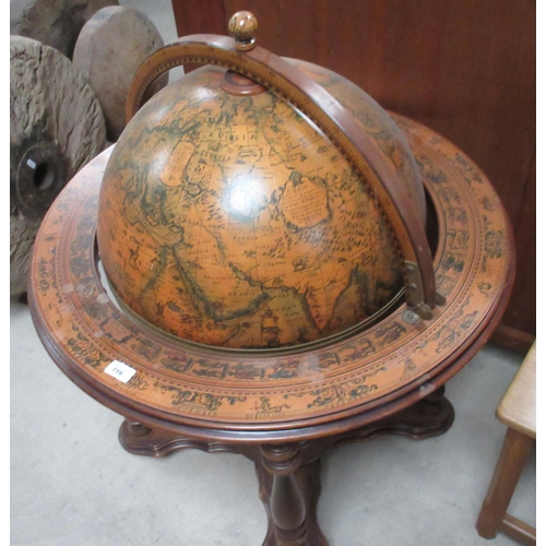 719 - Reproduction globe drinks cabinet with hinged lift up top revealing fitted interior on turned suppor... 