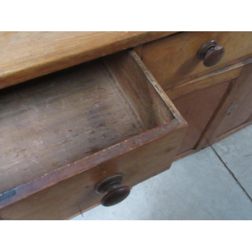 745 - Victorian pine kitchen dresser with angular raised back above central drawer and two panelled cupboa... 