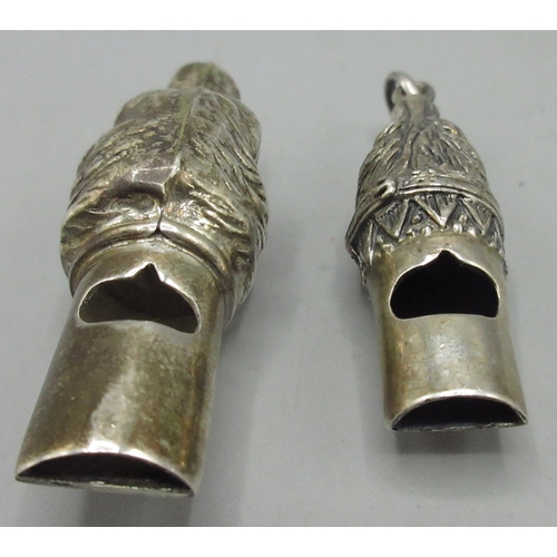 1132 - Two Victorian style silver whistles modelled as dog heads with suspension loop, both stamped 925, 5c... 