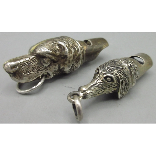 1132 - Two Victorian style silver whistles modelled as dog heads with suspension loop, both stamped 925, 5c... 