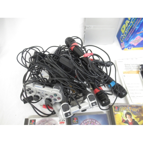 598 - Playstation 2 console, with 2 controllers, Dance Performance Mat, 3 Microphones, 6 PS1 games and 20 ... 