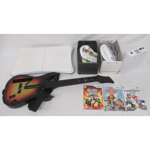 600 - Nintendo Wii console, controllers, Guitar Hero guitar, & 3 Wii games

Shipping £48.00 plus vat (UK O... 