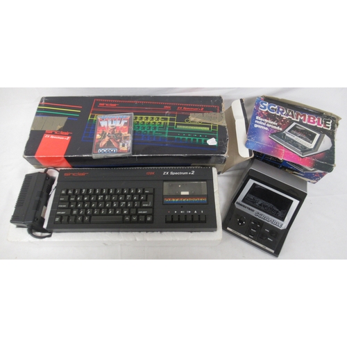 601 - Sinclair 128K ZX Spectrum +2 and a Scramble electronic mini arcade (a/f)

Shipping £48.00 plus vat (... 