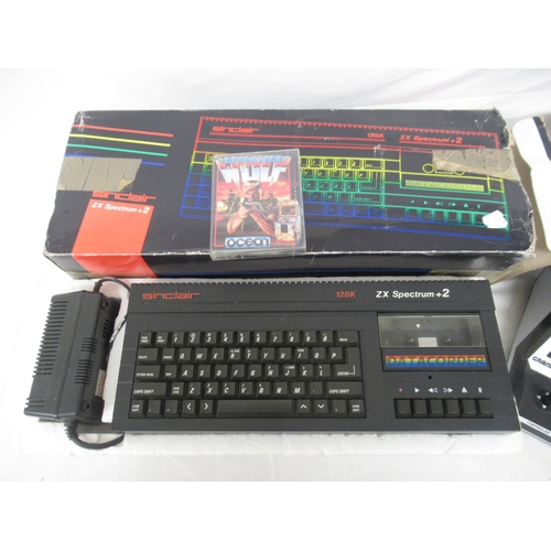 601 - Sinclair 128K ZX Spectrum +2 and a Scramble electronic mini arcade (a/f)

Shipping £48.00 plus vat (... 