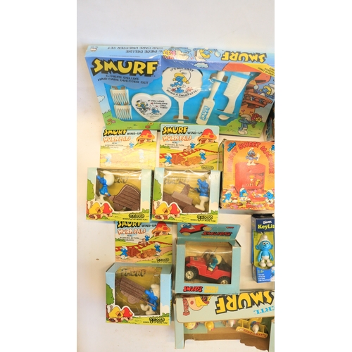 521 - Collection of Smurf themed toys, models, games, puzzles, magazines (including foreign language editi... 