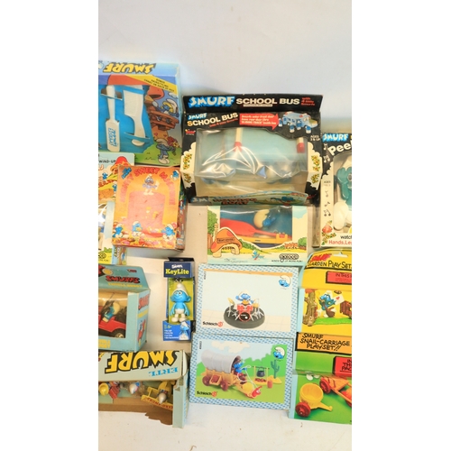 521 - Collection of Smurf themed toys, models, games, puzzles, magazines (including foreign language editi... 