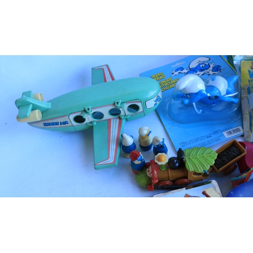 523 - Smurf collection to include soft toys, activity books, figures (including diecast Ertl), cardboard c... 