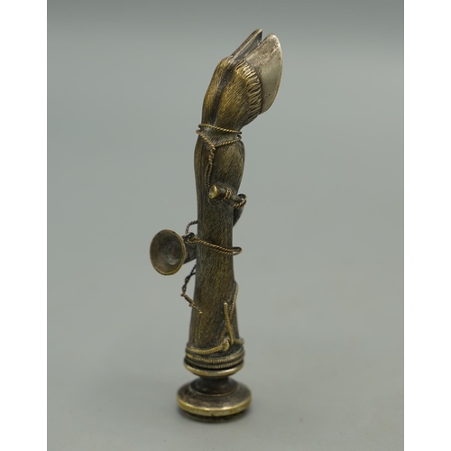 1408 - Early 20th century cast metal Deer slot pipe tamper, with rope tied hunting horn detail and screw of... 