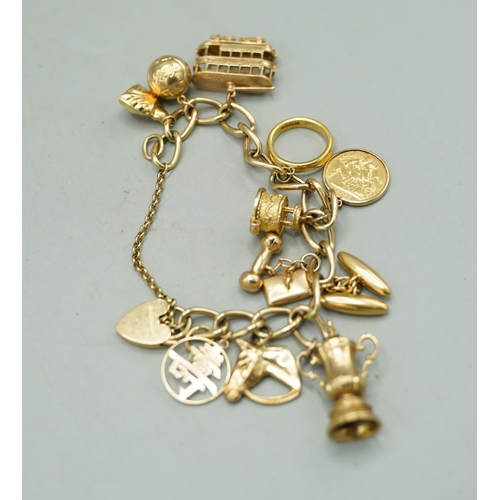 1005 - Yellow metal bracelet with 9ct yellow gold padlock clasp set with seven 9ct yellow gold charms inclu... 