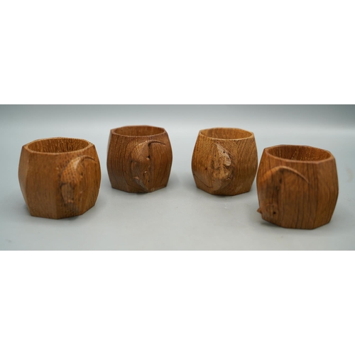 1448 - Robert Mouseman Thompson of Kilburn - a set of four octagonal oak napkin rings, each carved with sig... 