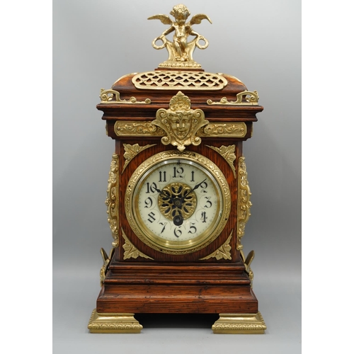 1399 - S. Marti, late 19th century French oak mantle timepiece, moulded case extensively decorated with bra... 