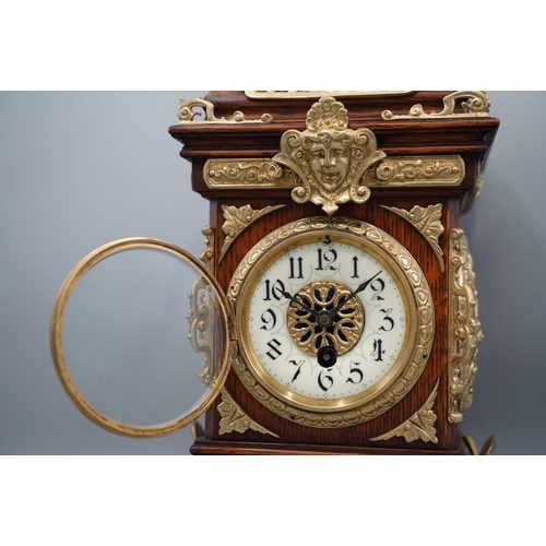 1399 - S. Marti, late 19th century French oak mantle timepiece, moulded case extensively decorated with bra... 