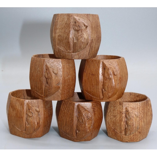 1457 - Robert Mouseman Thompson of Kilburn - a set of six octagonal oak napkin rings, each carved with sign... 