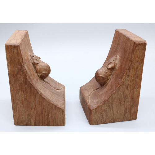 1445 - Robert Mouseman Thompson of Kilburn - a pair of adzed oak bookends, carved with signature single mic... 