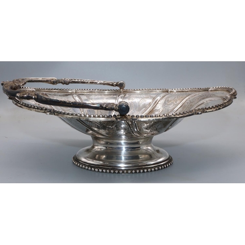 1068 - Victorian silver oval swing handled basket, engraved with C scrolls with beaded border and similar h... 