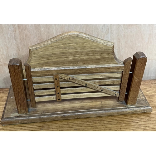 1535 - Sid Pollard of Thirsk - an oak farm gate letter rack with serpentine back on rectangular base, W33cm... 