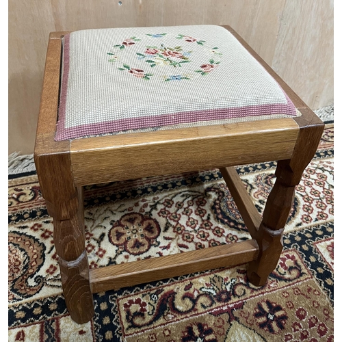 1553 - Mike Hammond of Kirkbymoorside- an oak square footstool, woolwork top on octagonal baluster supports... 