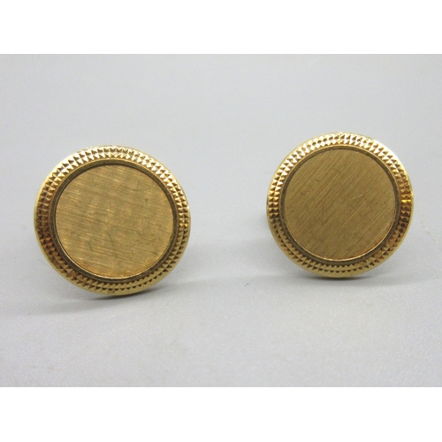 1004 - Patek Philippe 'Calatrava' 18ct yellow gold cufflinks, the textured centre surrounded by a hobnail b... 