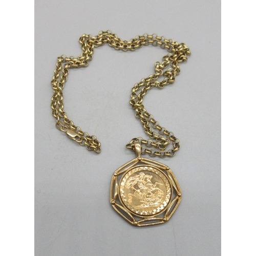 1006 - ER.II 2000 sovereign in ornate 9ct yellow gold mount, on 9ct yellow gold belcher chain, both stamped... 