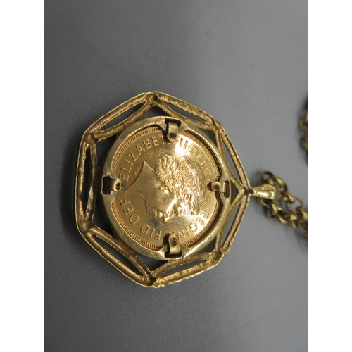 1006 - ER.II 2000 sovereign in ornate 9ct yellow gold mount, on 9ct yellow gold belcher chain, both stamped... 