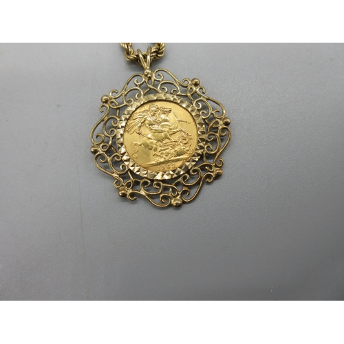 1010 - ER.II 1963 sovereign set in 9ct yellow gold ornate mount, stamped 375, on 9ct yellow gold rope twist... 