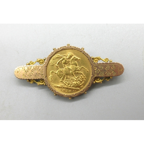 1020 - Geo.V 1913 sovereign set in 9ct rose and yellow gold mount with foliage detail, stamped 9ct, with wh... 