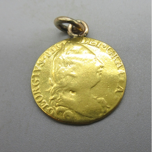 1016 - Geo.III 1779 fourth laur. head r. gold guinea, with soldered yellow metal bail, 8.93g