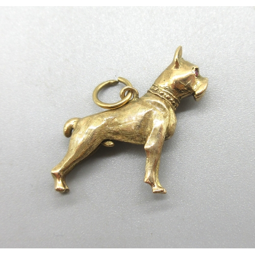 1025 - 9ct yellow gold boxer dog charm set with ruby eyes, stamped 375, approx. L3cm, 8.2g