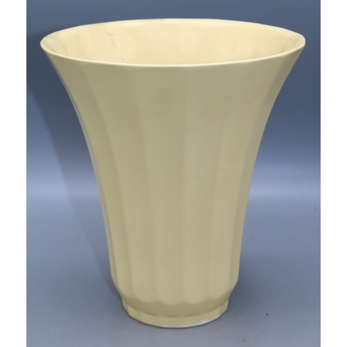 1193 - Keith Murray for Wedgwood, Art Deco trumpet vase of flared form, glazed in straw yellow, printed KM ... 