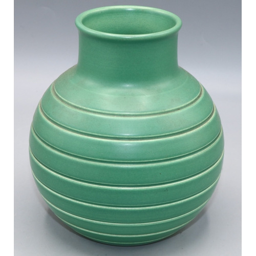 1188 - Keith Murray for Wedgwood, Art Deco globe vase decorated with incised lines, glazed in mid green, pr... 