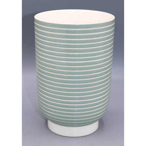 1189 - Keith Murray for Wedgwood, two-tone vase, footed cylindrical form, glazed in celadon green and white... 