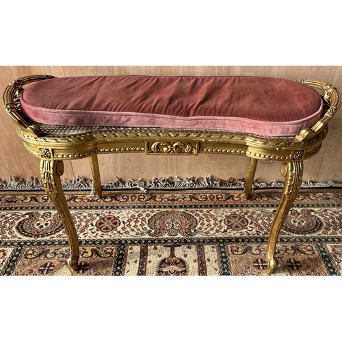 1568 - Late 19th century French giltwood shaped oval window seat, with ribbon tied floral swag pierced hand... 