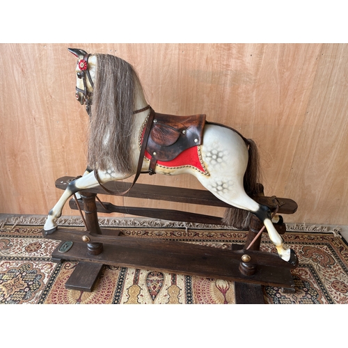 1555 - Traditional style Rocking horse by Ron Wood of Lancasters, in dapple grey with brown leather saddle ... 