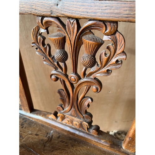 1599 - 19th century Scottish provincial oak open arm chair, curved top rail, Thistle carved splat, curved a... 