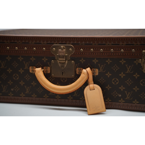 1421 - Louis Vuitton trunk case, brown monogram canvas, rounded leather carrying handle, with gold coloured... 