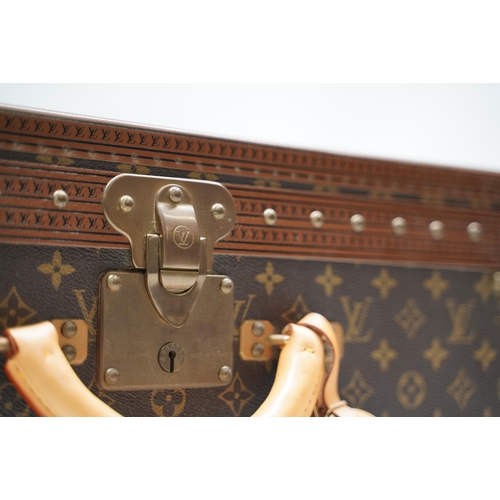 1421 - Louis Vuitton trunk case, brown monogram canvas, rounded leather carrying handle, with gold coloured... 