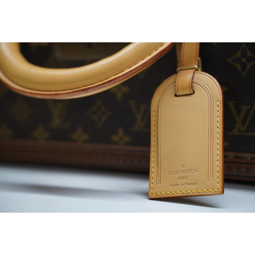 1421 - Louis Vuitton trunk case, brown monogram canvas, rounded leather carrying handle, with gold coloured... 