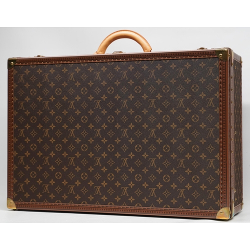 1421 - Louis Vuitton trunk case, brown monogram canvas, rounded leather carrying handle, with gold coloured... 