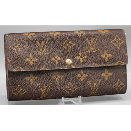 1432 - Louis Vuitton 'Sarah' wallet in brown monogram canvas with gold coloured hardware, flap with press s... 