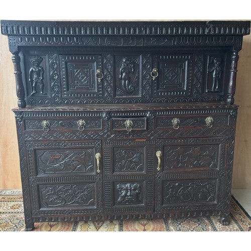 1557 - Large 17th century and later carved oak court cupboard, top with two lozenge carved doors and figura... 