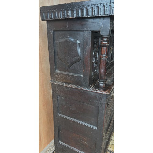 1557 - Large 17th century and later carved oak court cupboard, top with two lozenge carved doors and figura... 