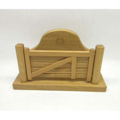 1541 - Carthorse Furniture Thirsk - an oak farm gate letter rack, with arched back on rectangular base, car... 