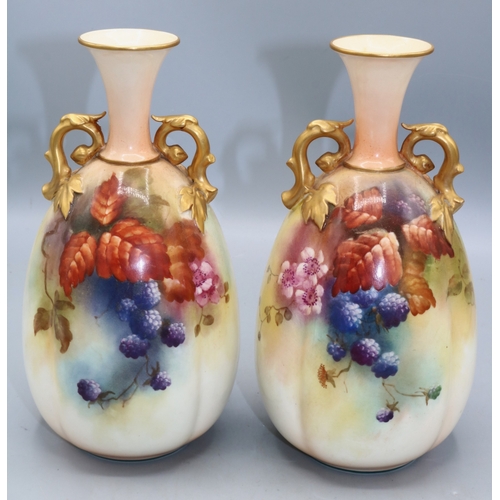 1167 - Pair of Royal Worcester twin handled ovoid vases painted with leaves and berries, H20cm